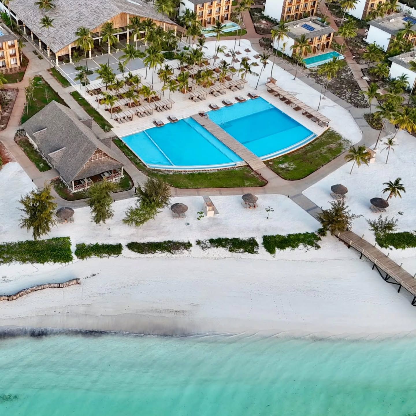 Aerial view of JAZ Aurora resort pools and Indian Ocean, Zanzibar